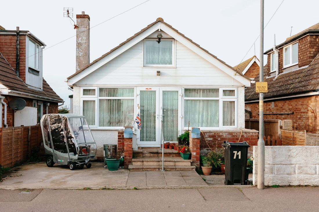 A house with a car parked in front of it